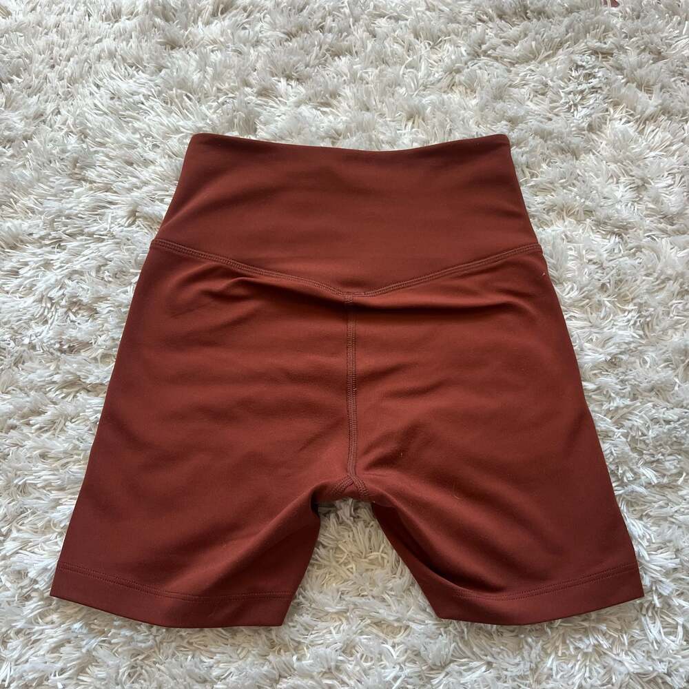 Girlfriend Collective XS High-Rise Biker Shorts in Rust